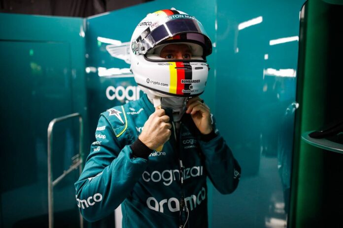 Sebastian Vettel, Aston Martin, puts on his crash helmet