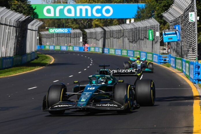Lance Stroll, Aston Martin AMR22, leads Sir Lewis Hamilton, Mercedes W13
